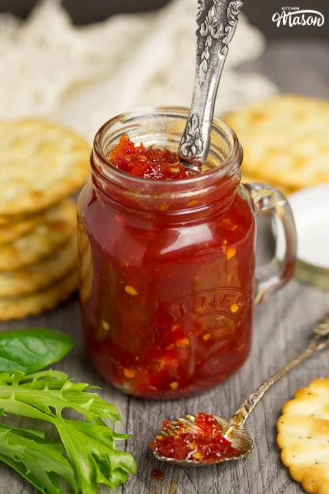 sweet chilli jam in a kilner jar with crackers, lettuce and garlic cloves