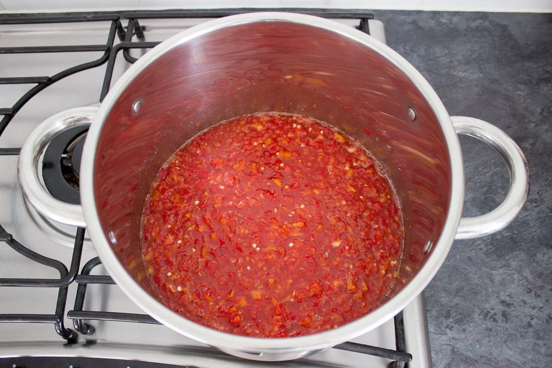 sweet chilli jam ingredients in a large pot on the hob