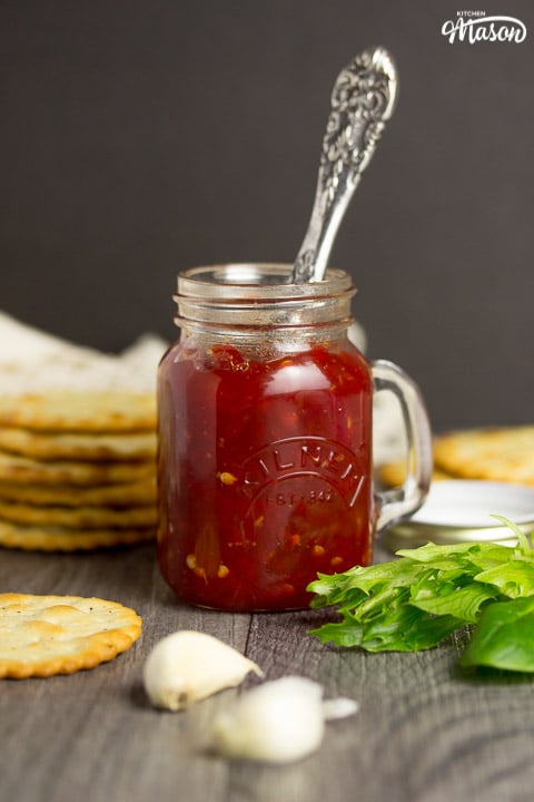 sweet chilli jam in a kilner jar with crackers, lettuce and garlic cloves