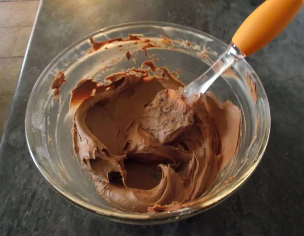 Mars Bar Cupcakes chocolate buttercream frosting in a glass bowl