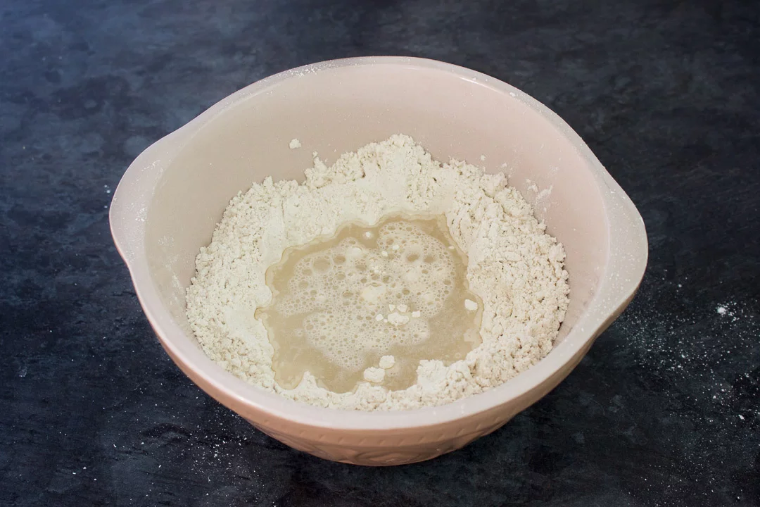 Flour, yeast, salt and luke warm water in a large mixing bowl