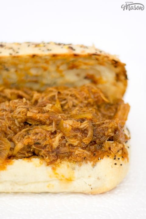 slow cooker pulled pork on a toasted roll