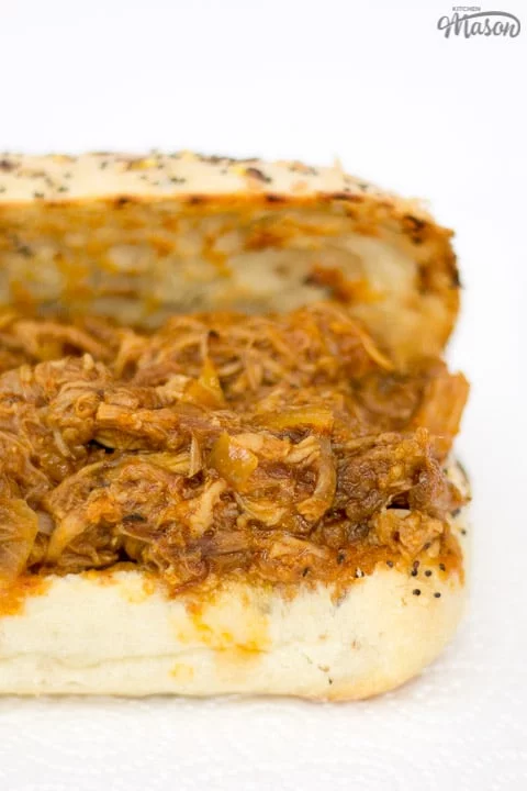 slow cooker pulled pork on a toasted roll