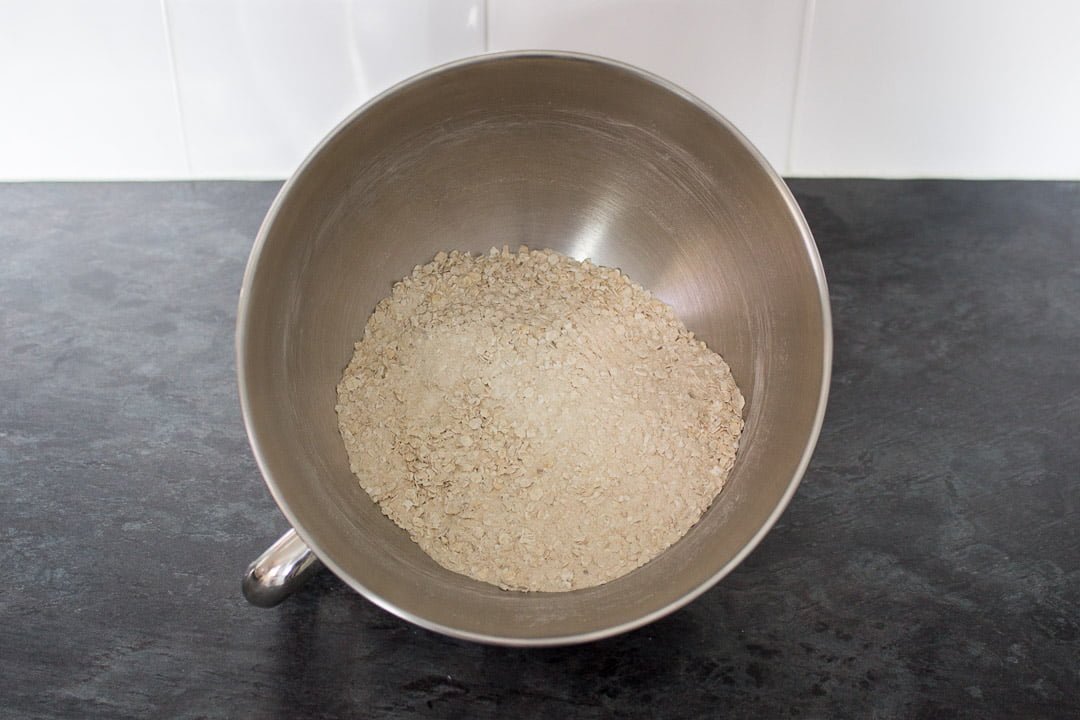 flour, sugar, oats, salt and bicarbonate of soda in the bowl of a stand mixer