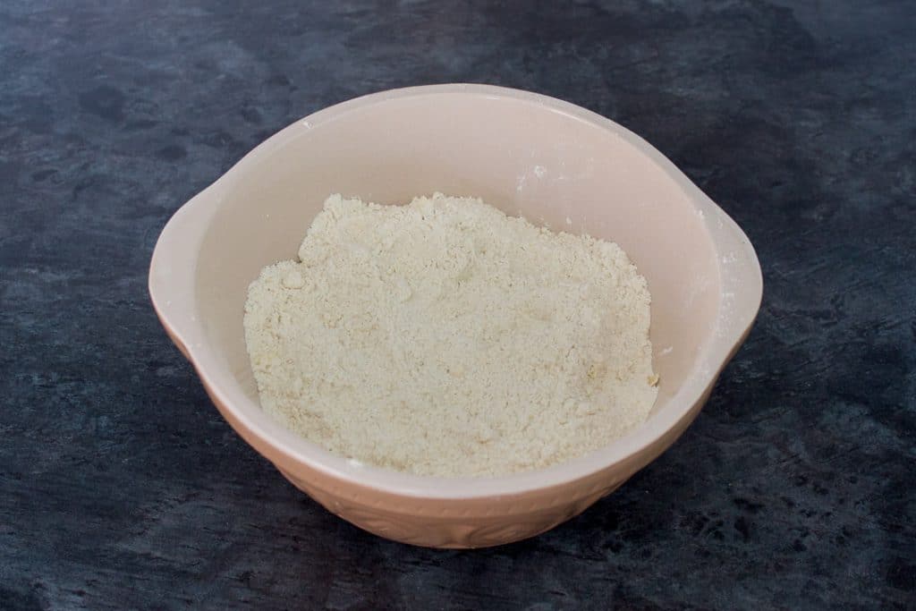 dry doughnut dough ingredients in a bowl