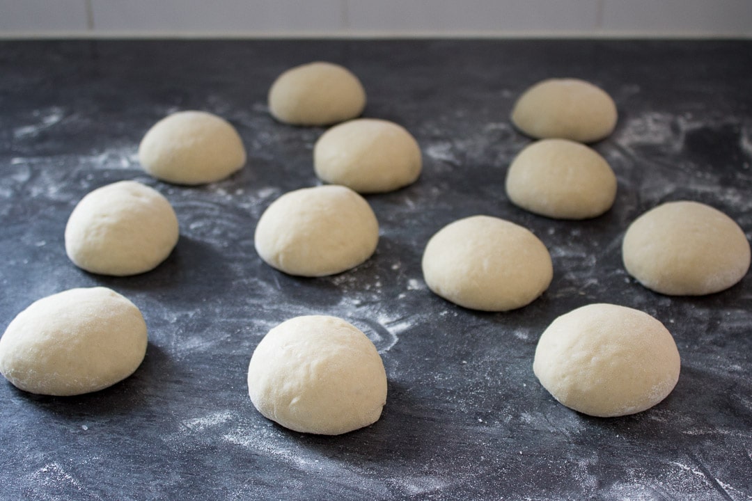 balls of homemade doughnut dough on a worktop