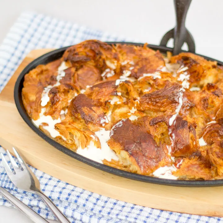 Caramel croissant pudding in a cast iron dish