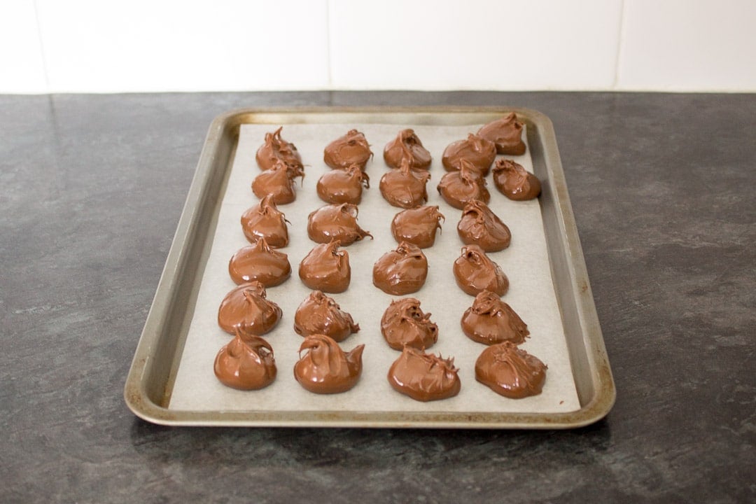 nutella blobs on a lined baking tray 