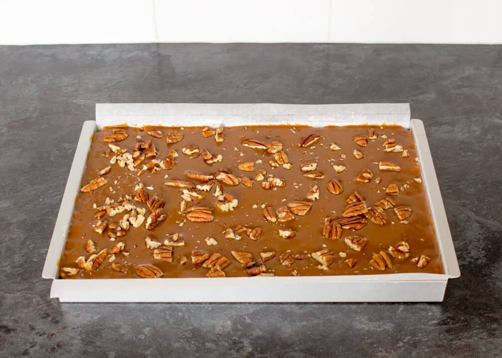 Caramel Krispie Bars in a tin before being sliced
