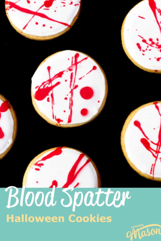Flat lay view of lots of blood spatter halloween cookies lay on a black backdrop. A text overlay says "blood spatter Halloween cookies".