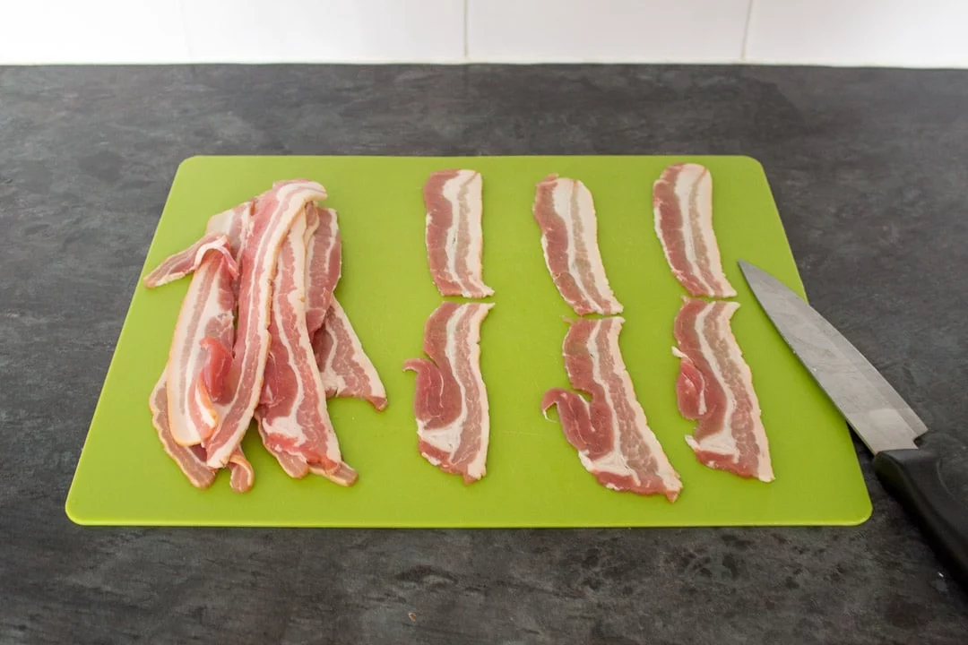 Bacon Halloumi Bites: bacon rashers on a chopping board