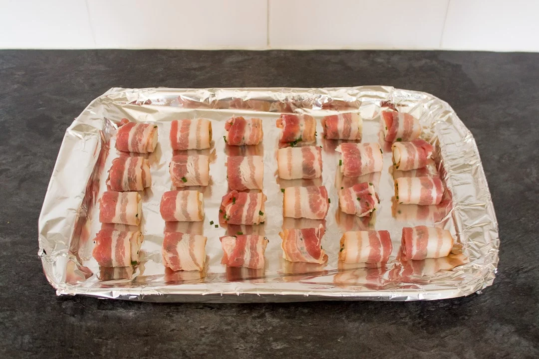 uncooked Bacon Halloumi Bites on a bacon tray