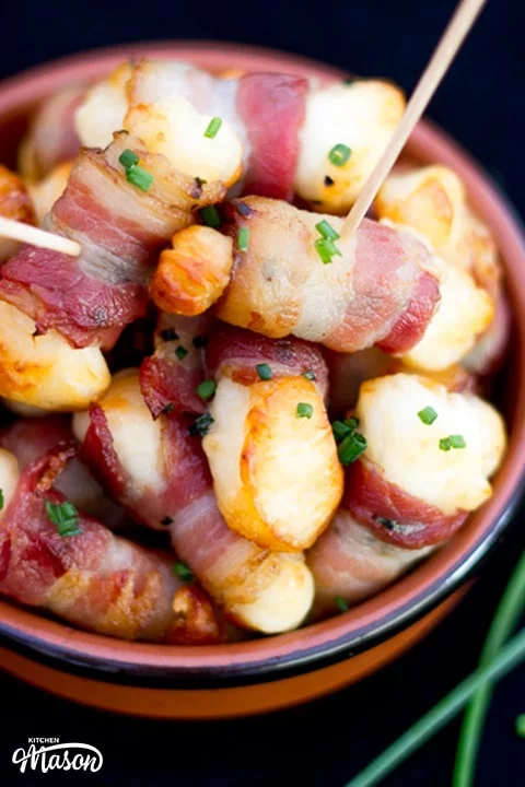 Bacon Halloumi Bites in a serving dish with cocktail sticks