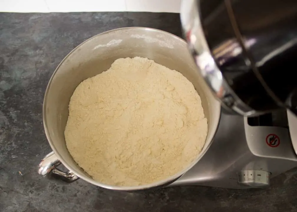 Dry cupcake ingredients in an electric stand mixer bowl