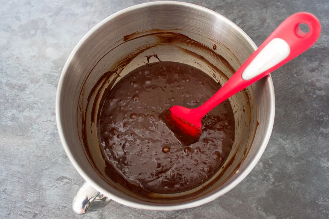 creme egg brownie batter in the bowl of an electric stand mixer