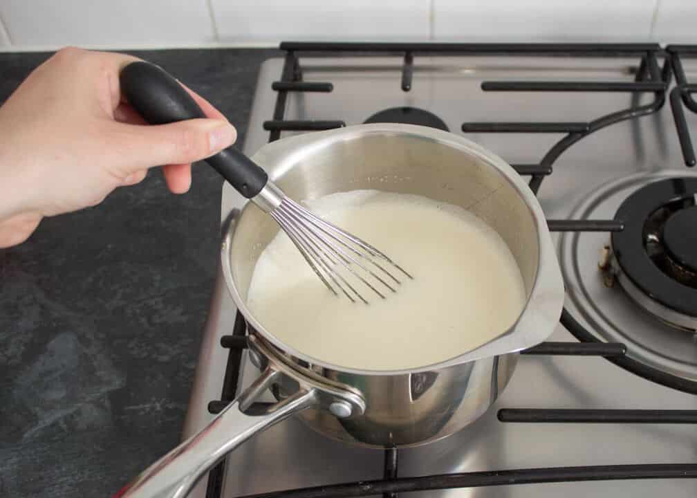 Rhubarb and Custard Ice Cream: cooking the custard mixture in a saucepan on the hob