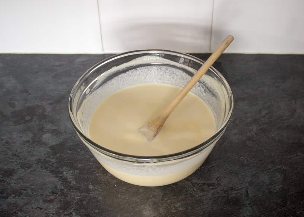 Rhubarb and Custard Ice Cream in a bowl ready for churning