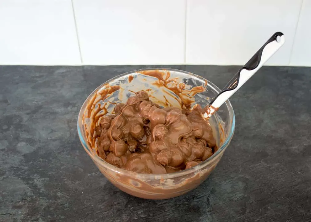 Maltesers Microwave Fudge mixture in a bowl with Maltesers mixed in