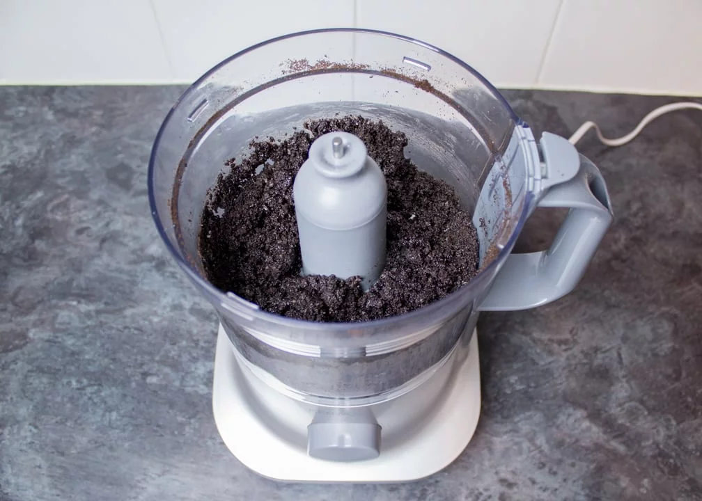 Oreo biscuit crumbs in a food processor