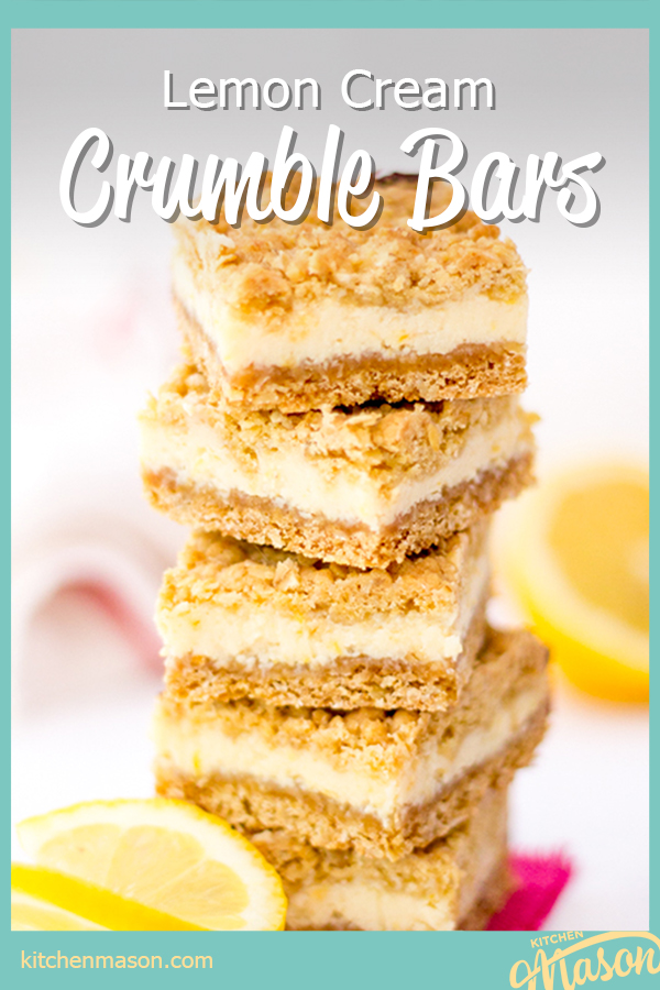 4 lemon cream crumble bars in a stack with a sliced lemon in the background