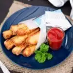 Halloumi Fries on a plate with tomato sauce