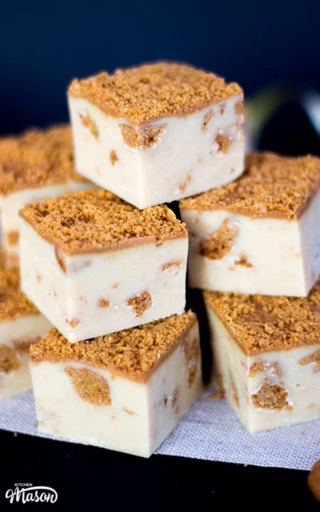 Biscoff fudge in a stack on baking paper