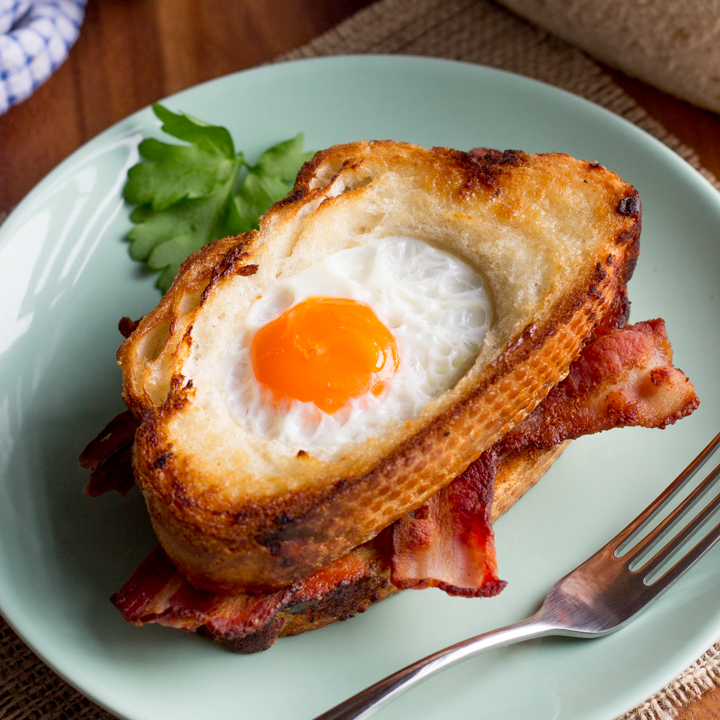 Easy Egg In A Hole Bacon Sandwich on a plate