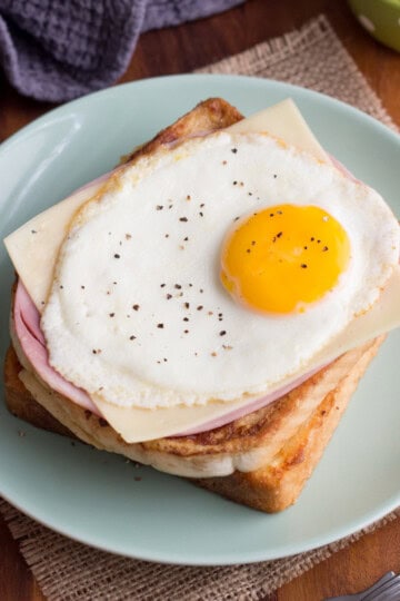 Ham egg and cheese savoury French toast on a plate with a fork