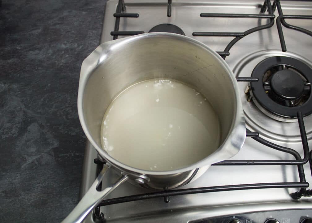 Sugar, cream of tartar and water in a saucepan over a low heat on the stove top.
