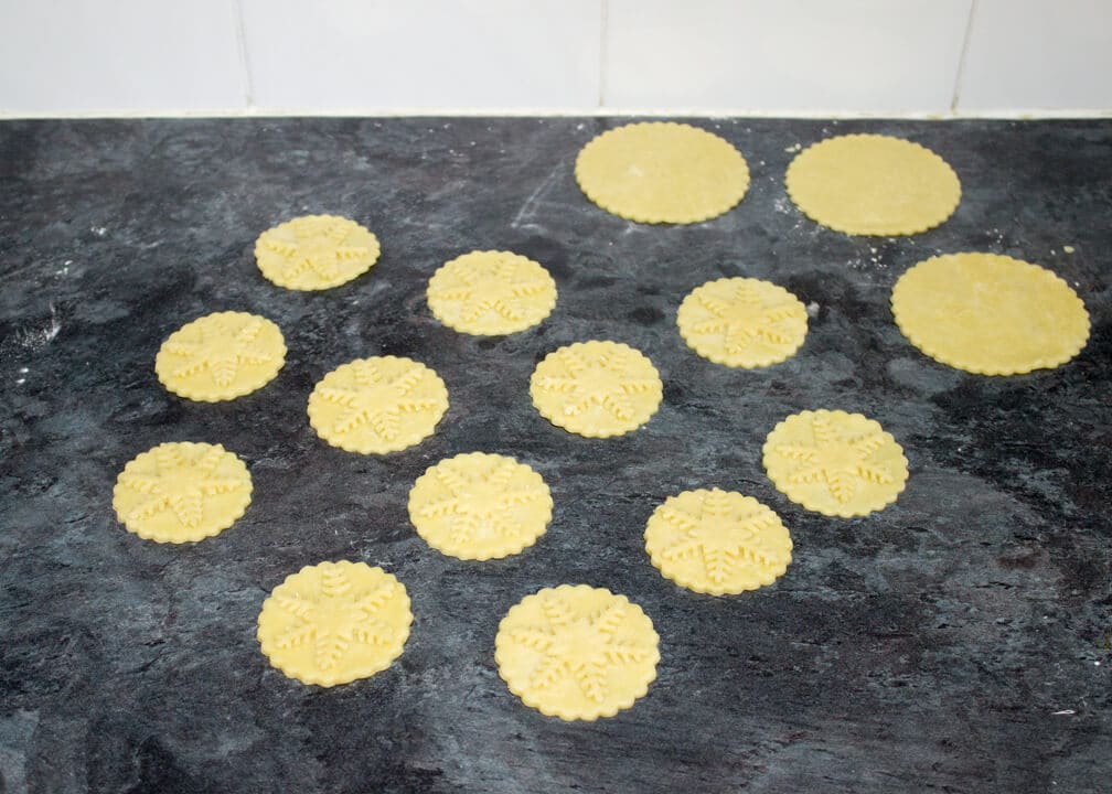 shortcrust pastry mince pie lids on a work surface