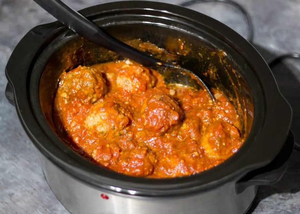 Meatballs in a sauce in a slow cooker