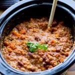 Slow cooker vegetarian chilli topped with parsley