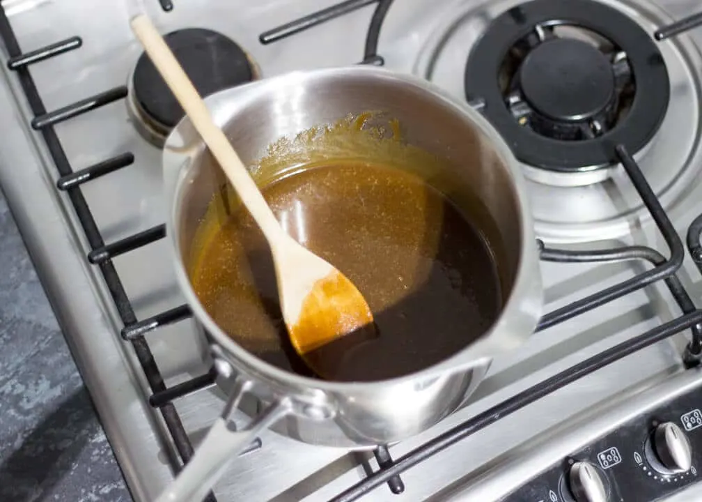 Flapjack Recipe: melted butter, sugar and golden syrup in a saucepan on the hob
