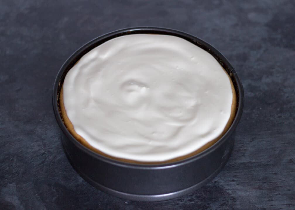 Sour cream topping on a baked cheesecake