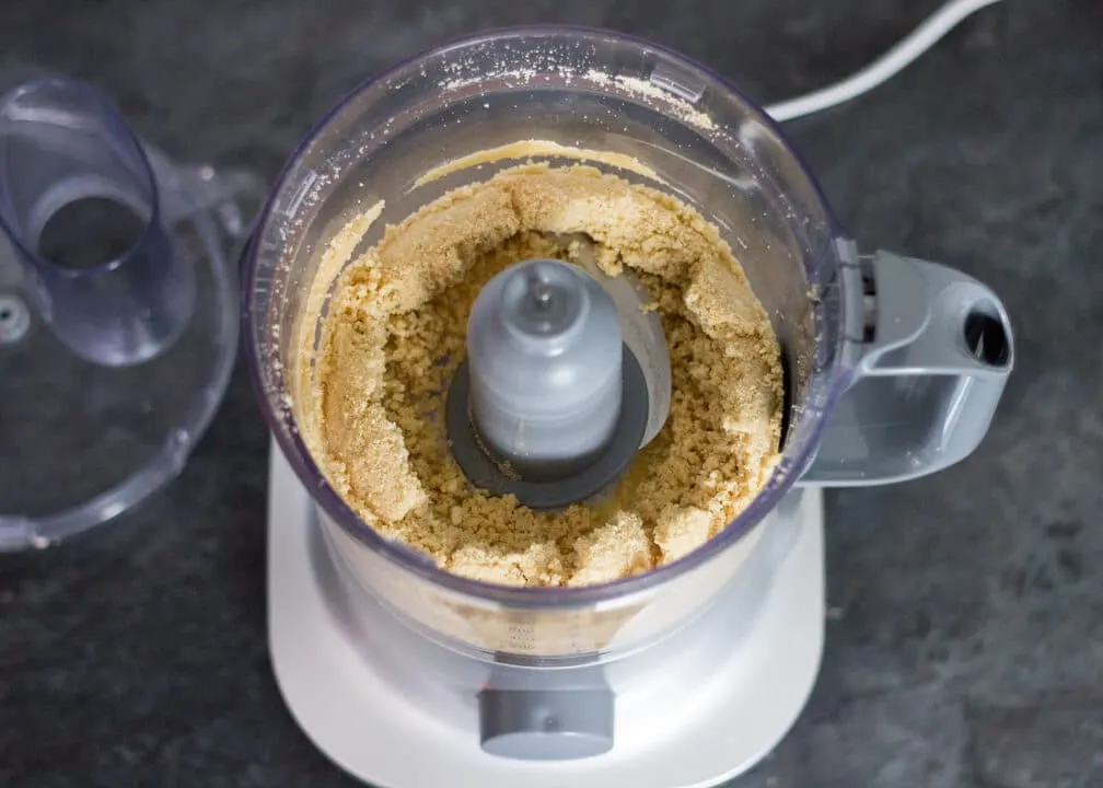 Baked cheesecake biscuit crumb base in a food processor