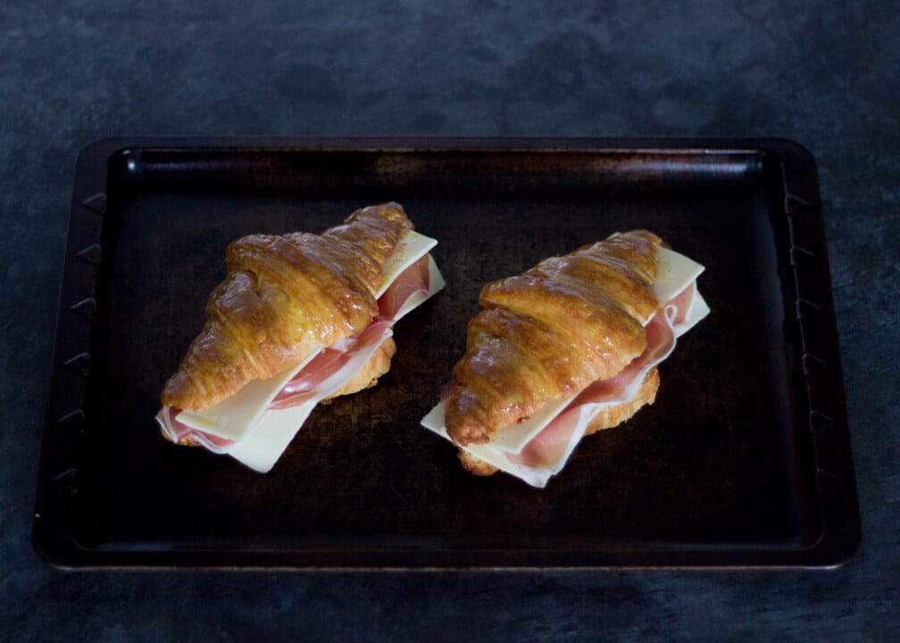 Croissant Sandwich with Prosciutto & Gouda on a Baking Tray