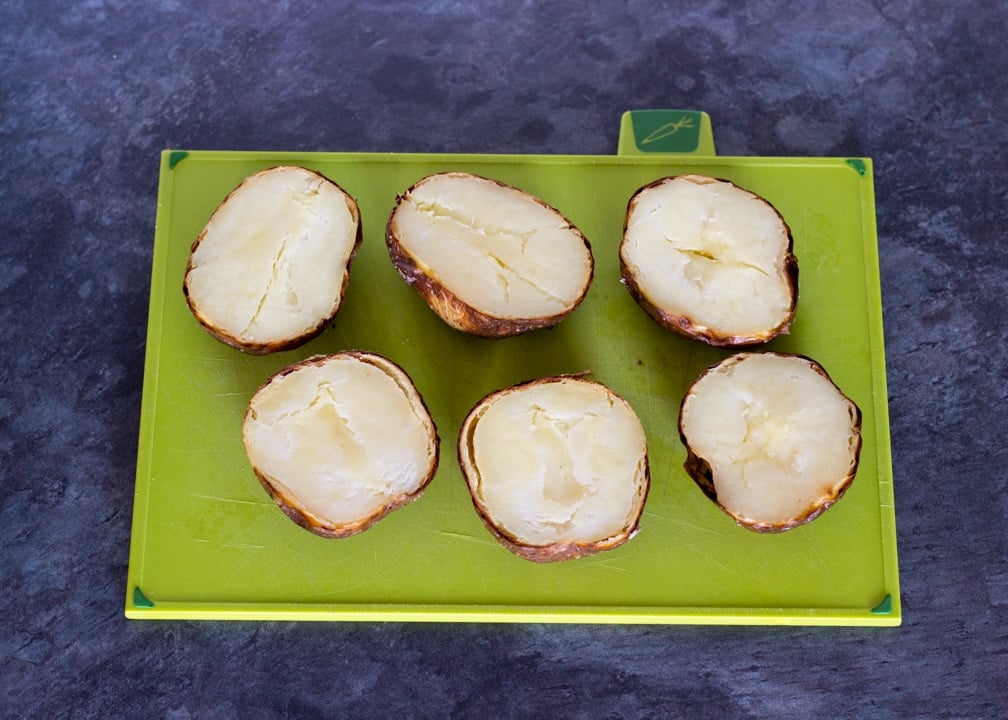 Baked,cooled and halved potatoes for loaded potato skins