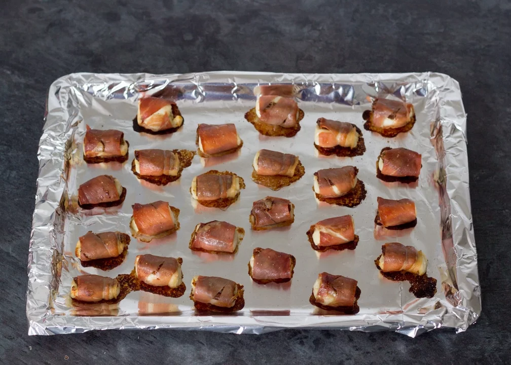 Party Snacks: Halloumi & sundried tomatoes wrapped in prosciutto cooked on a baking tray