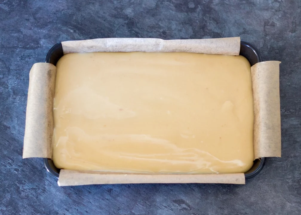 Chocolate Orange Caramel Shortbread: the caramel poured on top of the biscuit layer in a baking tin