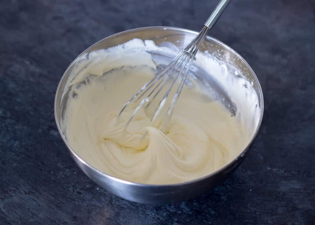 Lemon Cheesecake Recipe: double cream whipped to stiff peaks in a metal bowl