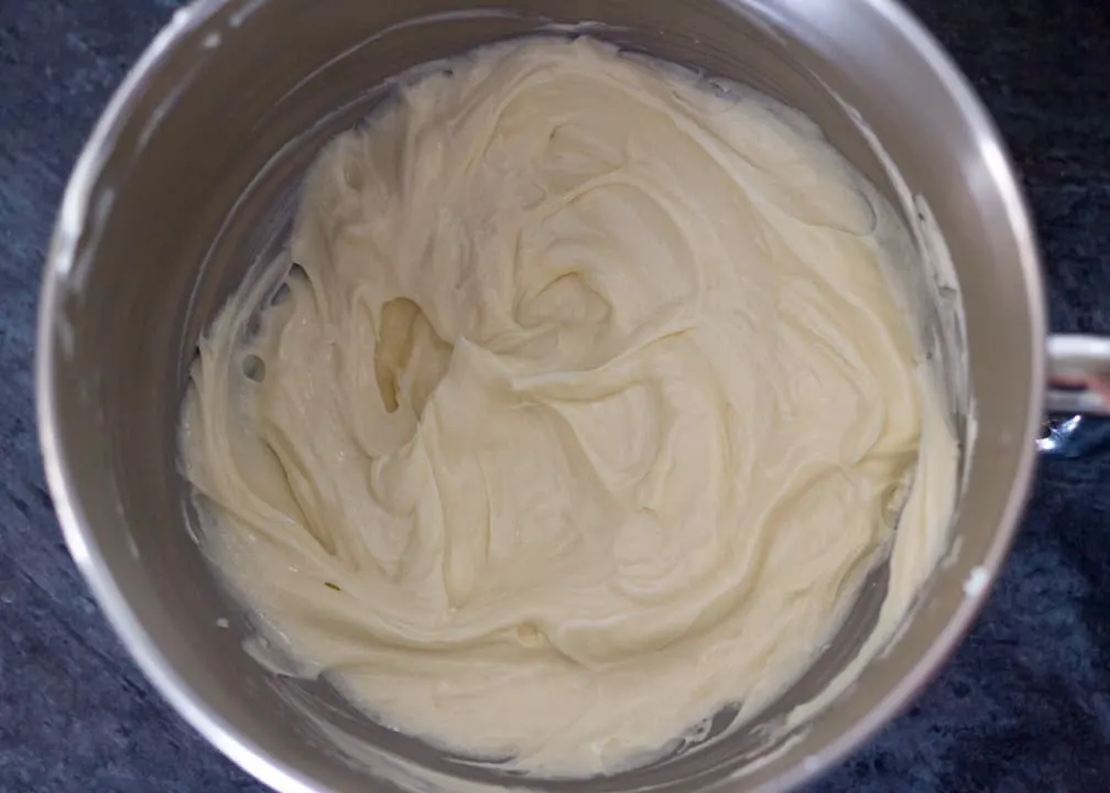 Lemon Cheesecake Recipe: beaten cream cheese and sugar in a stand mixer bowl