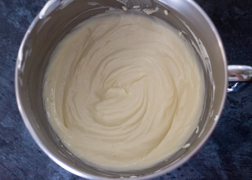 Lemon Cheesecake Recipe: beaten cream cheese, sugar and lemon curd in a stand mixer bowl