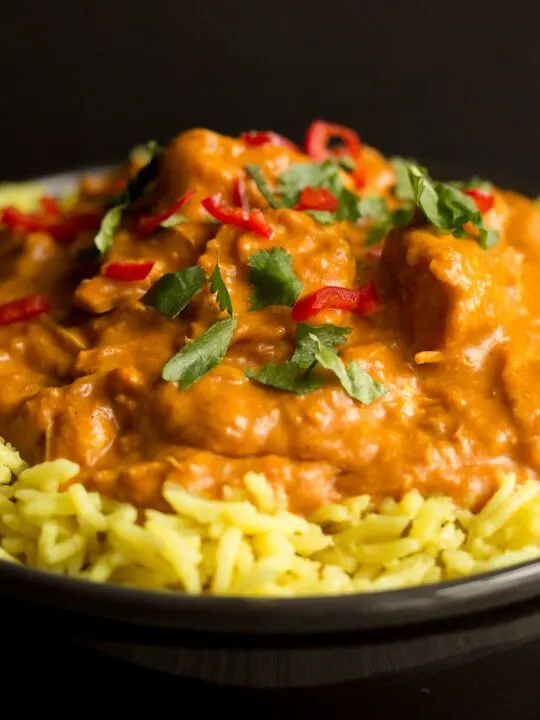 Slow cooker chicken curry in a bowl with rice