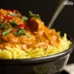 Slow cooker chicken curry in a bowl with rice