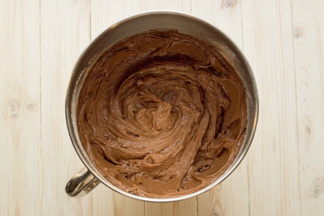Easy chocolate cake recipe ingredients in a large bowl mixed together