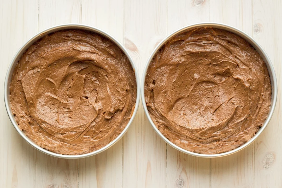 Easy chocolate cake recipe batter divided between two tins