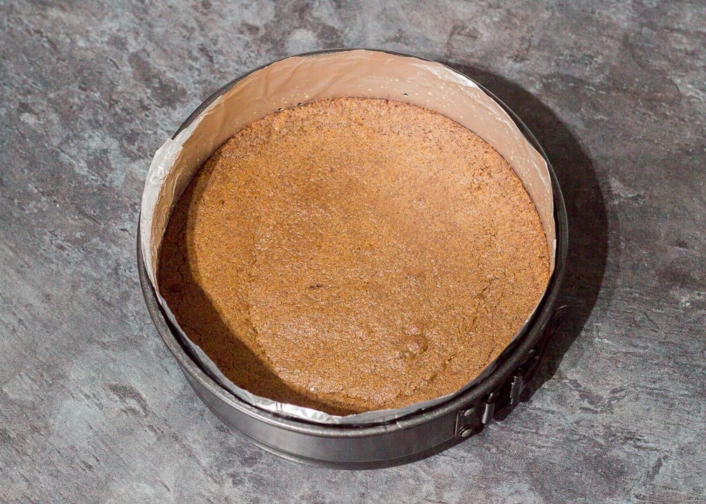 Baked Brownie in a lined round cake tin