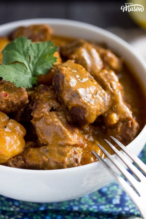 beef massaman curry in a white bowl