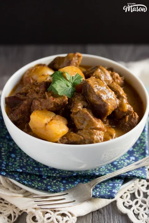 beef massaman curry in a white bowl