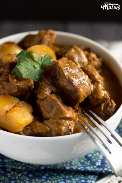 beef massaman curry in a white bowl